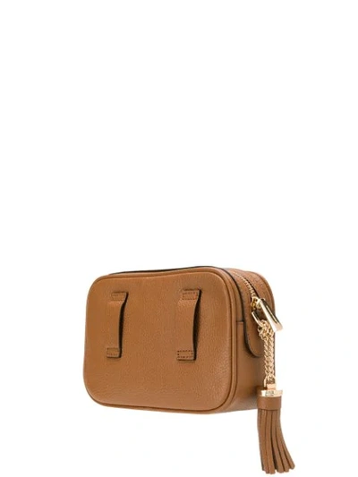 Shop Michael Michael Kors Tassel Belt Bag In Brown