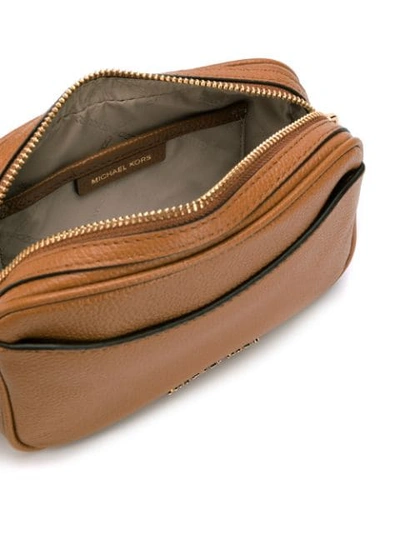 Shop Michael Michael Kors Tassel Belt Bag In Brown