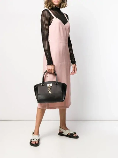 Shop Donna Karan Padlock Tote Bag In Black