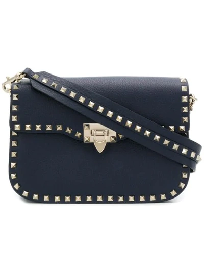 Shop Valentino Rockstud Messenger Bag In Blue