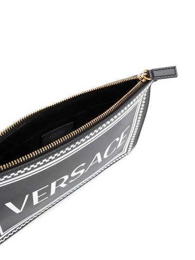 Shop Versace 90's Vintage Logo Clutch Bag In Black