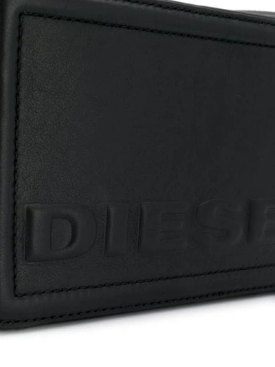 Shop Diesel Embossed Logo Crossbody Bag In Black