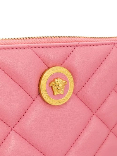 Shop Versace Quilted Medusa Clutch In Pink