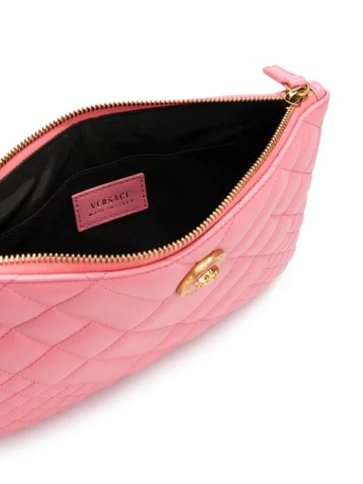 Shop Versace Quilted Medusa Clutch In Pink