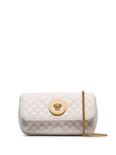 Shop Versace Quilted Shoulder Bag In White