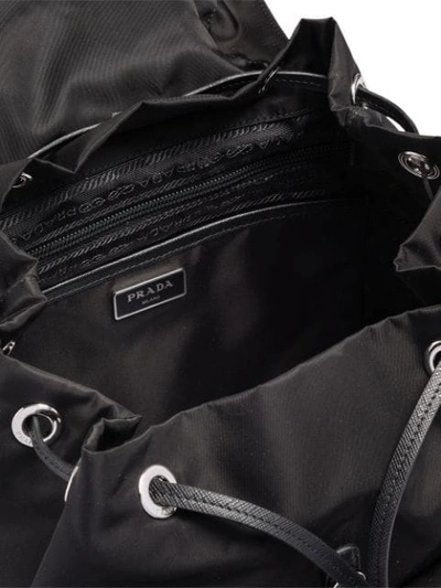 Shop Prada Studded Buckle Backpack In Black