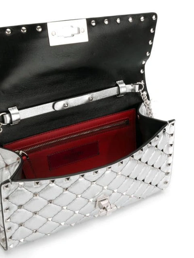Shop Valentino Garavani Spike Rockstud Shoulder Bag In Metallic