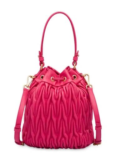 Shop Miu Miu Matelassé Drawstring Bucket Bag In Pink