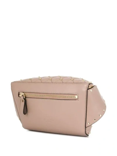 Shop Valentino Garavani Rockstud Belt Bag In Pink