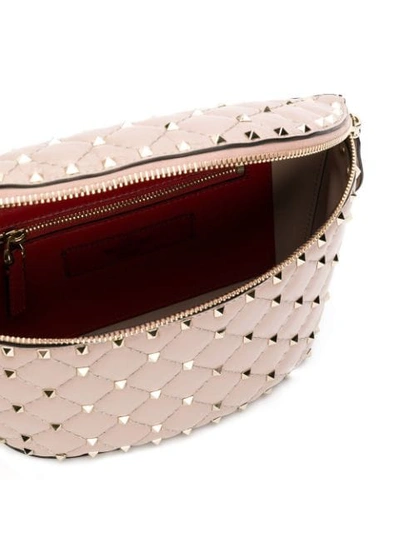 Shop Valentino Garavani Rockstud Belt Bag In Pink