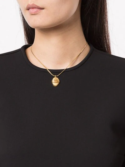 Shop Givenchy Oval Logo Pendant Necklace In Gold