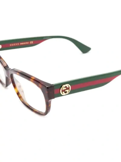 Shop Gucci Rectangular Frame Glasses In Brown
