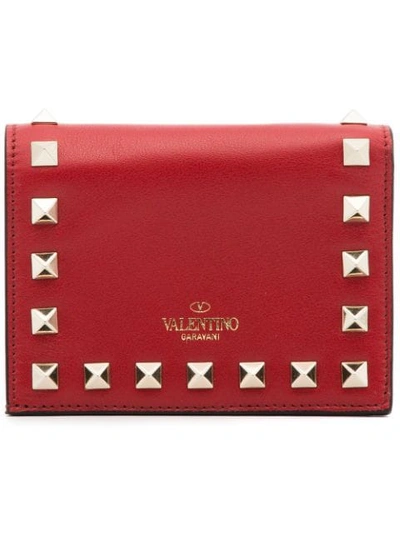 red rockstud fold over leather wallet