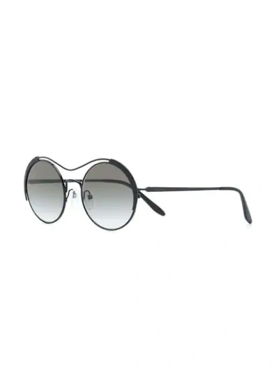 Shop Prada Round Sunglasses In Black