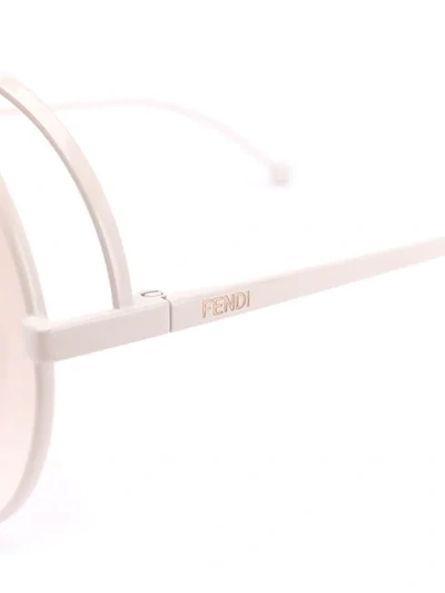 Shop Fendi Rama Round Frame Sunglasses In White
