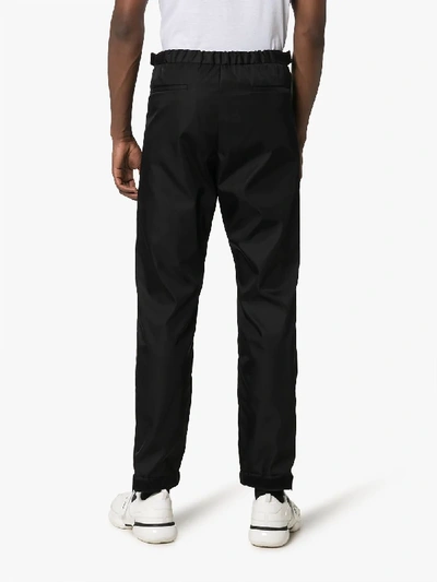Shop Prada Elasticated Cuff Trousers In Black