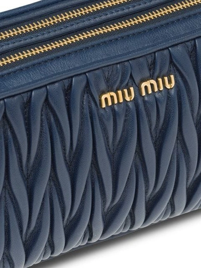 Shop Miu Miu Matelassé Make Up Bag In Blue