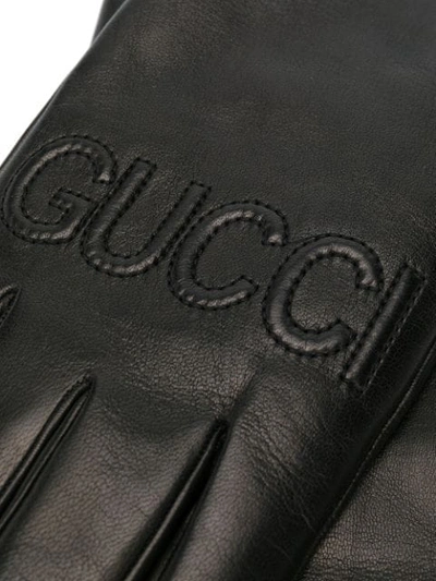 Shop Gucci Logo Embossed Gloves In Black