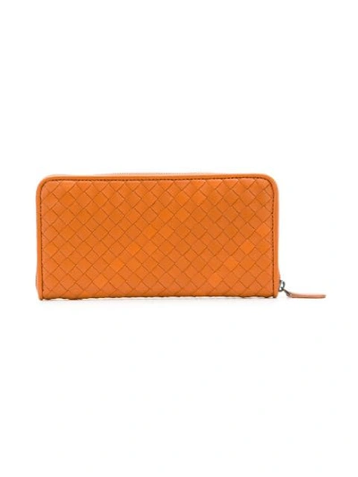 Shop Bottega Veneta Intrecciato Weave Zip-around Wallet In Orange