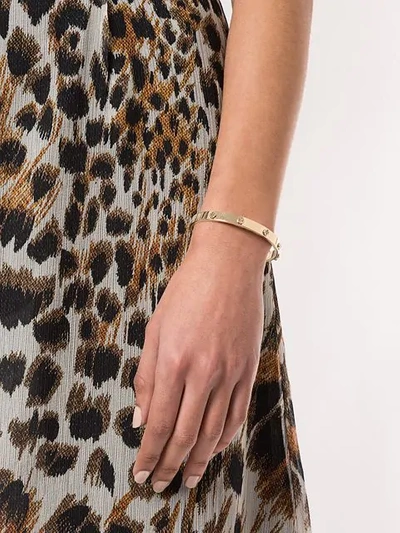 Shop Tory Burch Logo Stud Hinge Bracelet In Gold