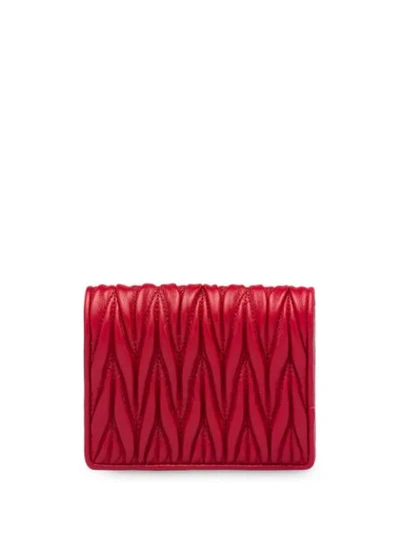 Shop Miu Miu Matelassé Embellished Logo Wallet In Red