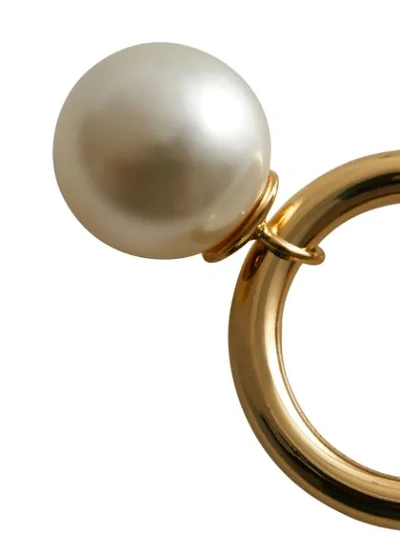 Shop Burberry Faux Pearl Charm Gold In Metallic