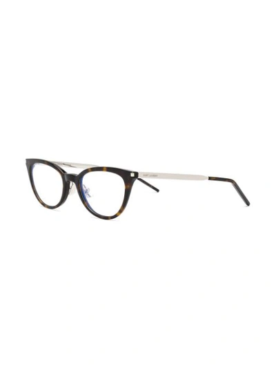 Shop Saint Laurent Cat Eye Glasses In Brown