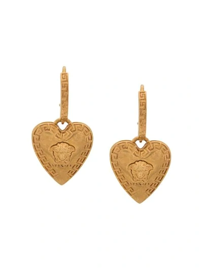 Shop Versace Heart-shaped Medusa Motif Earrings In Gold