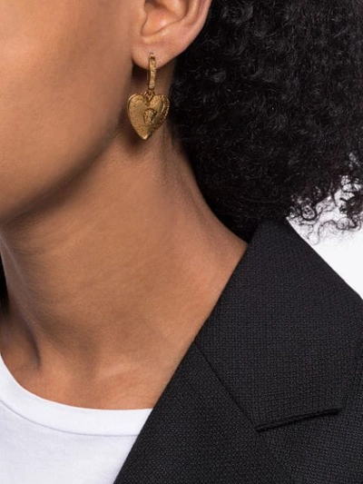 Shop Versace Heart-shaped Medusa Motif Earrings In Gold
