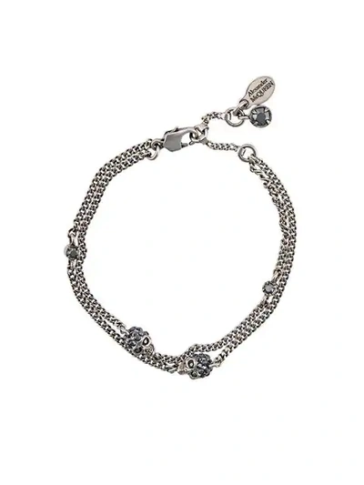 Shop Alexander Mcqueen Skulls Bracelet In Metallic