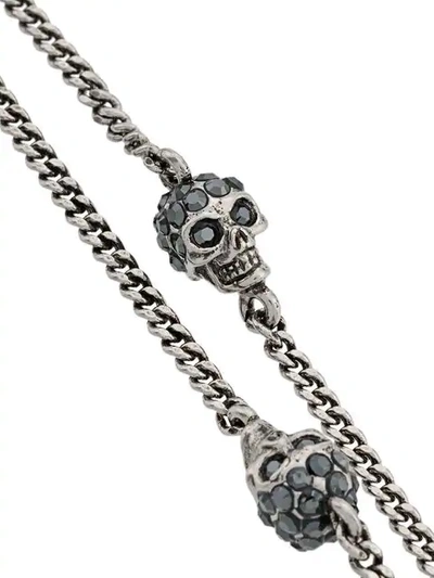 Shop Alexander Mcqueen Skulls Bracelet In Metallic