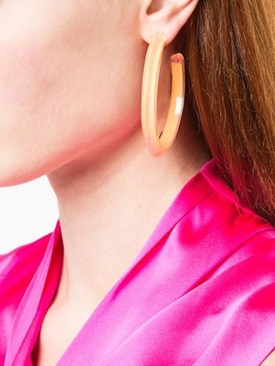 Shop Alison Lou Medium Jelly Hoops In Neon Orange