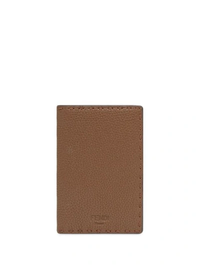 Shop Fendi Embossed Logo Passport Cover In Brown