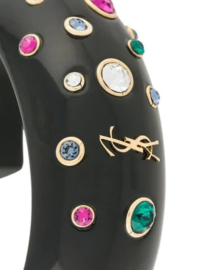 Shop Saint Laurent Logo Embellished Cuff Bracelet In Black