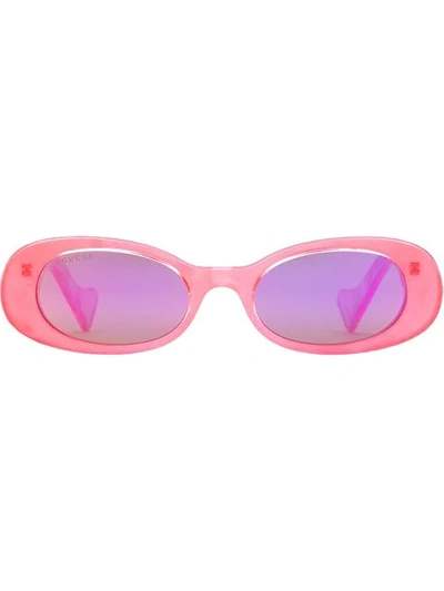 Shop Gucci Oval Frame Sunglasses In Pink