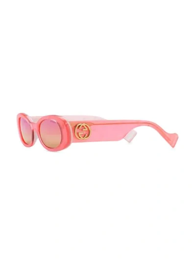 Shop Gucci Oval Frame Sunglasses In Pink