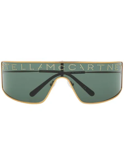 Shop Stella Mccartney Studded Logo Mask Sunglasses In Gold