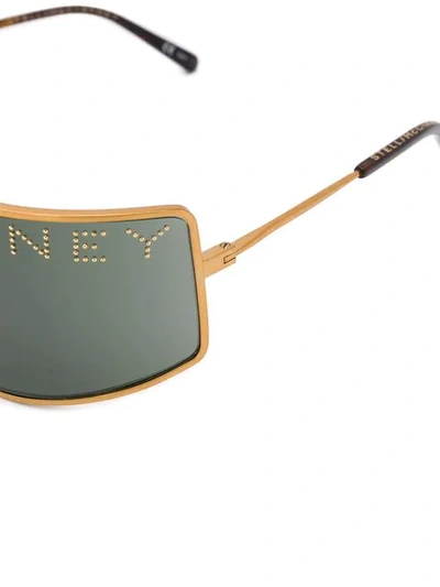 Shop Stella Mccartney Studded Logo Mask Sunglasses In Gold