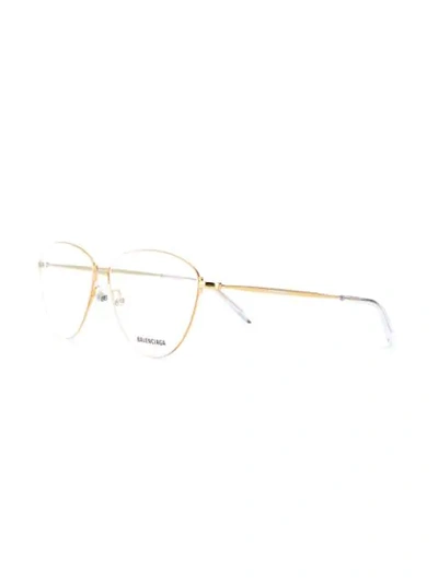 Shop Balenciaga Oval-frame Glasses In Gold