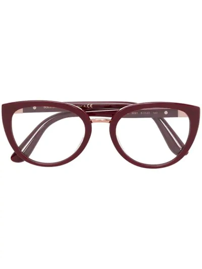Shop Dolce & Gabbana Oval Frame Glasses In Red