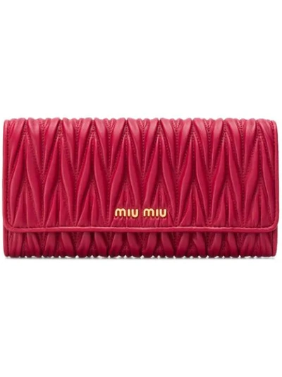 Shop Miu Miu Matelassé Foldover Wallet - Red