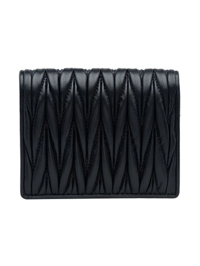 Shop Miu Miu Quilted Logo Bi-fold Wallet In Black