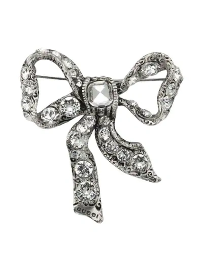 Shop Gucci Bow Brooch In Metal In Metallic