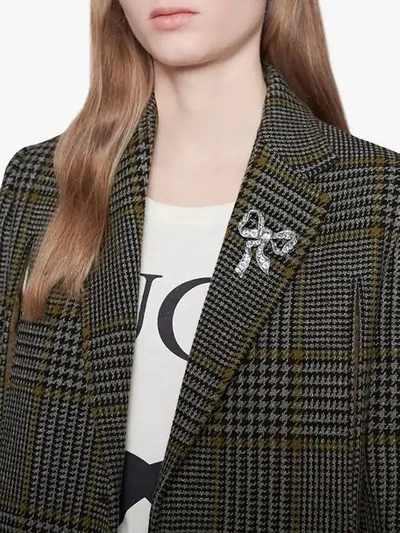 Shop Gucci Bow Brooch In Metal In Metallic