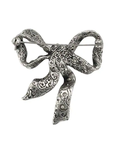 Shop Gucci Bow Brooch In Metal In Metallic