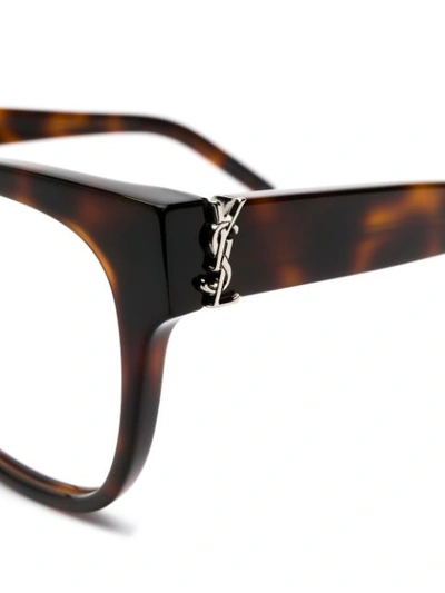 Shop Saint Laurent Oval Shaped Glasses In Brown