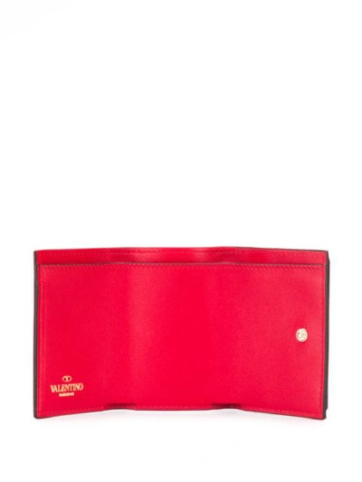 Shop Valentino Garavani Small Rockstud Wallet - Red