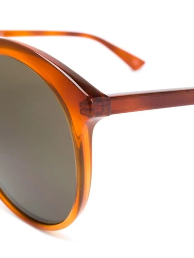 Shop Gucci Round Shaped Sunglasses In Yellow