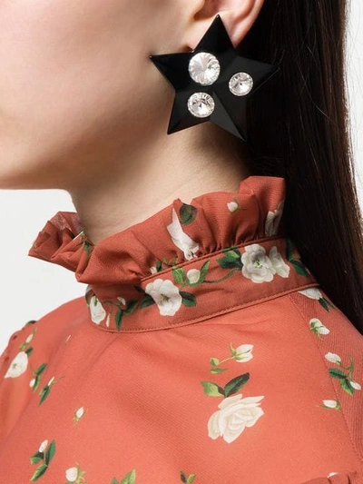 Shop Miu Miu Crystal Embellished Star Earrings In Black