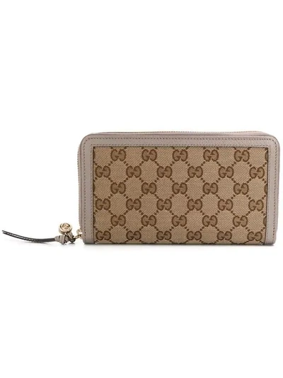 Shop Gucci Gg Supreme Zip Around Wallet In Neutrals